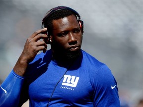 Defensive end Jason Pierre-Paul #90 of the New York Giants warms up prior to a game against the Arizona Cardinals at MetLife Stadium on September 14, 2014 in East Rutherford, New Jersey.   Ron Antonelli/Getty Images/AFP