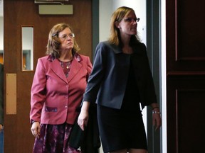In this Dec. 8, 2014 file photo, Arlene Holmes, left, mother of James Holmes who is charged in the killing of 12 moviegoers and the wounding of 70 others in a shooting spree in a crowded theatre in Aurroa, Colo., on July 20, 2012, leaves the courtroom. After more than two months of testimony in the trial, new details have been revealed to show the strained relationship that had developed between Holmes, his parents and sister leading up to the massacre in the theatre. AP Photo/David Zalubowski, File