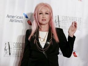 Singer Cyndi Lauper poses on the red carpet before the Songwriters Hall of Fame ceremony in New York, June 18, 2015.  REUTERS/Shannon Stapleton