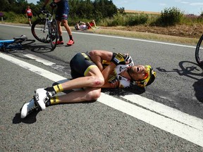 Lotto-Jumbo rider Laurens ten Dam of the Netherlands lies on the ground after a fall during the 159.5 km third stage of the 102nd Tour de France from Anvers to Huy, Belgium, on Monday, July 6, 2015. (Benoit Tessier/Reuters)