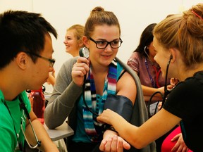 High school students get a few hands-on lessons as a part of the MedLINCS program, which aims to draw aspiring health care workers to the field and keep them in smaller communities. The program is celebrating its 10th year. (Handout photo courtesy of Jason Boutsayaphat/The Observer/Postmedia Network)