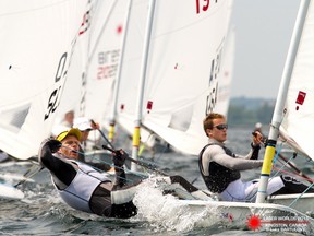 Brazil's Robert Scheidt, left, and Kingston's Robert Davis compete during Day 4 of the Laser World championship on Lake Ontario in Kingston on July 5. (Sailing Shot)