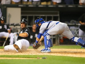 Chicago White Sox first baseman Jose Abreu slides into home safely during the eighth inning against the Toronto Blue Jays at U.S Cellular Field on July 6, 2015. (Caylor Arnold/USA TODAY Sports)