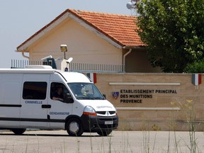 A criminal investigation van of the French Gendarmerie leaves a military base in Miramas , southern France, Tuesday, July 7, 2015.  French authorities are investigating the theft of roughly 200 detonators plus grenades and plastic explosives from the military site. AP Photo/Claude Paris