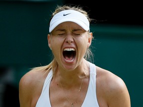 Maria Sharapova of Russia reacts after breaking serve during her match against Coco Vandeweghe of the U.S.A. at the Wimbledon Tennis Championships in London, July 7, 2015.                     REUTERS/Stefan Wermuth
