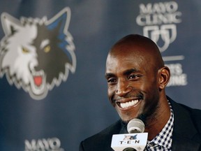 Minnesota Timberwolves star Kevin Garnett takes questions as he is re-introduced by the NBA Timberwolves basketball team during a news conference in Minneapolis. (AP Photo/Jim Mone, File)