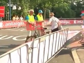 A mailman in the Netherlands threatens Tour de France workers after finding his route is blocked.