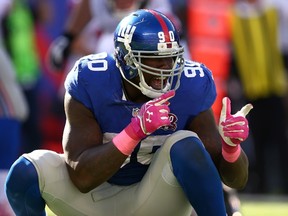 The senior vice-president of the Giants will visit defensive end Jason Pierre-Paul on Tuesday after the defensive end injured himself lighting fireworks during the July 4th holiday weekend. (Elsa/Getty Images/AFP)