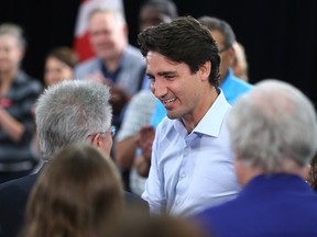 Liberal leader Justin Trudeau greets supporters at a town hall meeting at the Norwood Hotel in Winnipeg on Sat., July 5, 2015. Kevin King/Winnipeg Sun/Postmedia Network
