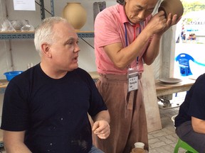 Londoner Chris Snedden, vice president of FUSION: The Ontario Clay and Glass Association, waits for a master potter in South Korea to test his work (photo submitted).