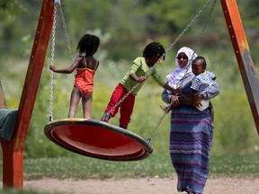 A family plays at the Albion-Heatherington Recreation Centre in Ottawa Tuesday July 7, 2015. The city of Ottawa is trying to decide which city community should receive funding for projects.  Tony Caldwell/Ottawa Sun/Postmedia Network