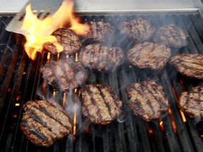 Burgers cook on the grill outside the Alberta Legislature in Edmonton on Wednesday October 10, 2012.  TOM BRAID/EDMONTON SUN