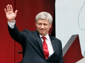 Prime Minister Stephen Harper waves after addressing the Canada Day crowd on Parliament Hill in Ottawa, Wednesday July 1, 2015. THE CANADIAN PRESS/Fred Chartrand