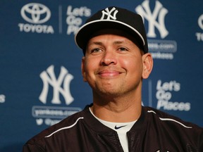Yankees' Alex Rodriguez answers questions during a news conference in which he was presented with the ball of his 3,000th career hit in New York on Friday, July 3, 2015. (Julie Jacobson/AP Photo)