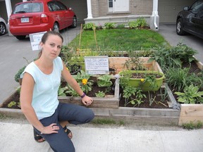 Shannon Lough says she won't be moving her front-yard garden even after the city told her to move it and take it down by July 30. JULIENNE BAY/OTTAWA SUN