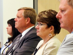 Quinte Health Care board members Tricia Anderson, left, and Steve Blakely sit with president and chief executive officer Mary Clare Egberts and chief of staff Dr. Dick Zoutman during a board meeting in Belleville Tuesday. The board heard of ongoing provincial funding cuts and paid tribute to several outgoing members.