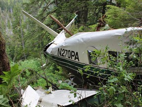 This photo, posted Sunday, June 28, 2015, on the Twitter page of the National Transportation Safety Board, shows the wreckage of a sightseeing plane that crashed in remote, mountainous terrain about 25 miles from Ketchikan in southeast Alaska on Thursday, June 25. All nine people on board were killed in the crash. A federal accident report released Tuesday, July 7, 2015, says the sightseeing floatplane was equipped with technology to provide better information about the terrain.  (National Transportation Safety Board via AP, File)