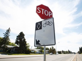 A bike lane sign is seen advising of a bike lane along 95 Avenue at 158 Street on Tuesday. City council voted to remove the controversial, two-year-old bike lanes. (Ian Kucerak/Edmonton Sun)