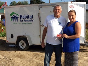 Submitted photo: 
Recently. Re:find Charity Thrift Shoppe's manager, April Tuininga presented construction coordinator Pete DeJonge at the Wallaceburg Habitat for Humanity Chatham-Kent build site on Forhan Street to drop off a donation for use towards needed building supplies for the Davis family's new Habitat Home.