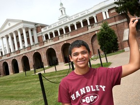 In this June 23, 2015 photo, John Handley High School sophomore Joseph Rosenfeld poses for a photo at the school in Winchester, Va. Rosenfeld discovered a decades-old math error that had gone unnoticed at the Museum of Science in Boston during a visit in June, but the museum now says the equation is actually correct. Jeff Taylor/The Winchester Star via AP