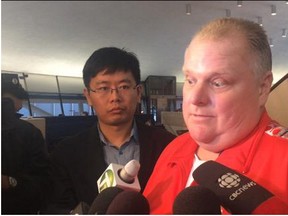 Councillor Rob Ford speaks to reporters at City Hall on Wednesday, July 8, 2015. (DON PEAT/Toronto Sun)