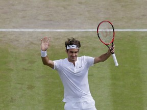 Roger Federer celebrates winning the singles match against Gilles Simon at the All England Lawn Tennis Championships in Wimbledon, London, Wednesday, July 8, 2015. (Tim Ireland/AP Photo)
