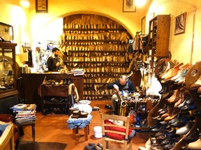 If you head for off-the-beaten-path neighborhoods in Europe, you'll find many small family businesses like this cobbler's shop in Florence. RICK STEVES PHOTO