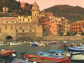 Sunrise heightens the charm of Italy's seaside villages — such as Vernazza in the Cinque Terre. DOMINIC ARIZONA CONUCCELLI