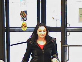 Investigators are hoping someone recognizes this woman sought in connection with a fraud investigation. (Toronto Police handout)