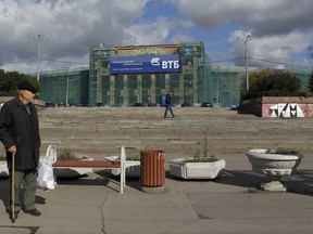 Pedestrians walk past the Dinamo Stadium currently under reconstruction, one of the contending stadiums to host the 2018 soccer World Cup, in Moscow, Russia, in this September 29, 2012 file photo. (REUTERS/Maxim Shemetov/Files)