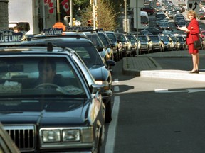 More than 200 taxi cabs protested on Sept. 26, 2000 in the city's downtown core. SUN FILES
