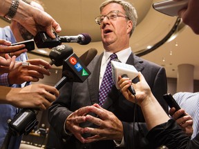 Ottawa Mayor Jim Watson speaks with members of the media following the last council meeting before their summer break. Wednesday July 8, 2015. Errol McGihon/Ottawa Sun/Postmedia Network