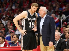 Head coach Gregg Popovich and Matt Bonner #15 of the San Antonio Spurs confer as they play the Los Angeles Clippers during Game Five of the Western Conference quarterfinals of the 2015 NBA Playoffs at Staples Center on April 28, 2015 in Los Angeles. (Stephen Dunn/Getty Images/AFP)