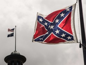 The Confederate battle flag flies at the South Carolina state house grounds July 8, 2015 in Columbia, South Carolina. South Carolina lawmakers will continue the debate today on whether to remove the flag from the capitol grounds. (Sean Rayford/AFP)