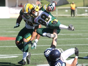 Eskimos returner Skye Dawson is tackled by Argonauts' Dave Stala during the first-week loss to Toronto. (Robert Murray, Postmedia Network)