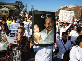 In this Feb. 14, 2015, file photo, marchers carry photos of police shooting victim Antonio Zambrano-Montes during a rally in Pasco, Wash. (Joshua Trujillo/seattlepi.com via AP, File)