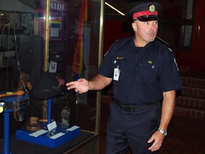 Jim Valade, a seconded instructor at Aylmer Police College, stands next to a display case holding antique police equipment during a tour of the college on Saturday, Sept. 14, 2013. The college was one of many sites taking part in Doors Open East Elgin, which welcomed visitors to many historic sites.