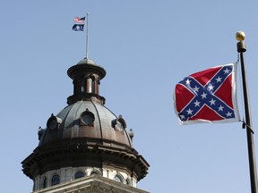 A Confederate flag flies at the base of a confederate memorial in front of the South Carolina State House in Columbia, S.C., on July 4, 2015. (REUTERS/Tami Chappell)