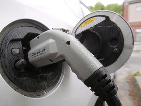 Ikea Canada says it is installing charging stations for electric vehicles at all 12 of its stores across Canada. An electric vehicle is shown attached to a charging station on June 18, 2013 in Montpelier, Vt. (THE CANADIAN PRESS/AP-Toby Talbot)