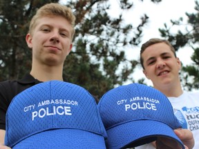 SAMANTHA REED/FOR THE INTELLIGENCER
Andrew Erskine (right) and Daniel Barker pose at Zwicks Park Thursday morning. The local teens were hired as summer students for Belleville Police’s Youth in Policing Initiative, which allows teens to have a hands-on look at policing.