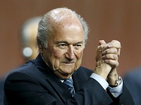 FIFA president Sepp Blatter has no problem with the criticism levelled his way following the corruption scandal engulfing the soccer organization, but says he's not directly responsible for what goes on at the executive committee level. (Arnd Wiegmann/Reuters/Files)