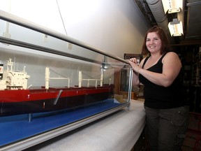 Sandrena Raymond, the curator of the Marine Museum of the Great Lakes in Kingston, stands by a ship model of the Fednav Federal Mayumi on Wednesday July 8 2015 which will be part of the new Marine Superhighway exhibit which will open at the museum on Saturday. Ian MacAlpine/The Kingston Whig-Standard/Postmedia Network