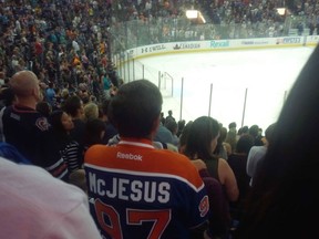A fan wears a jersey paying tribute to Connor McDavid.