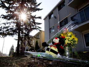 A small memorial has been set up at the scene of a July 8, 2015 fatal single vehicle accident outside the Red Lion apartment building, 9845 - 82 Avenue, in Edmonton Alta. on Thursday July 9, 2015. David Bloom/Edmonton Sun