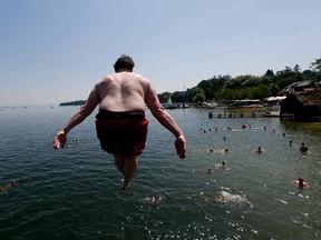 A boy jumping into a lake. 

REUTERS/Michael Dalder