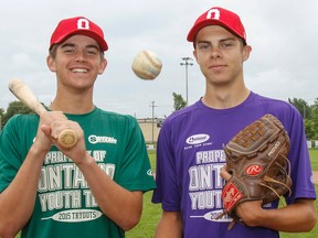 Kingston’s Ethan Hunt, left, and Matt Brash, at Megaffin Park on Thursday, have made the final cut and are now members of Team Ontario, which  will be competing at the Baseball Canada Cup championship in Saskatoon in August. (Julia McKay/The Whig-Standard)