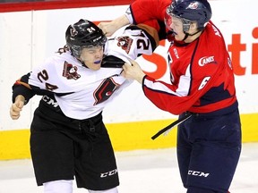 At 6-foot-3, 207 pounds, Lethbridge Hurricanes defenceman and Maple Leafs prospect Andrew Nielsen (right) has built a reputation as a big hitter within the WHL ranks. (POSTMEDIA/FILES)