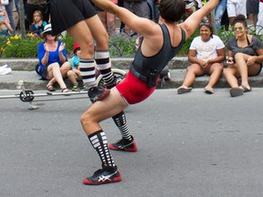 The Secret Circus, a spy-themed and juggling duo, performed on Thursday on Princess Street at the 27th annual Kingston Buskers Rendezvous.