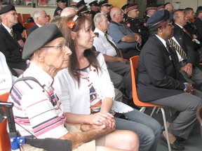 Second World War veteran Leonard Brown, front left, and Dawn Heuston, were among those who gathered at Fire Station No.1 in Chatham to watch the 30,000th playing of the Last Post in Ypres, Belgium. Since 1928, the buglers with the Ypres fire brigade sound the Last Post to pay tribute to the fallen soldiers of the First World War.