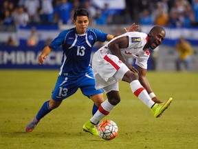 El Salvador's Alexander Larin, left, and Canada's Tosaint Ricketts vie for the ball during the second half of a CONCACAF Gold Cup soccer match on July 8 in Carson, Calif. (AP Photo/Mark J. Terrill)